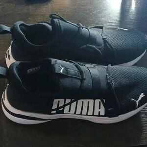Puma sneakers size 10...worn once..blk n white..gr8 for walk or jog. We bundle..